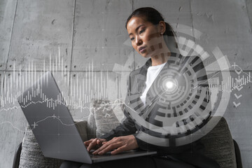 Businesswoman typing on laptop work in modern office on new project. financial market graph drawing hologram. Double exposure. Concept of success.