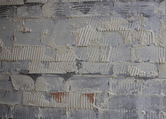 old tile glue or cement . broken wall tiles.wall without tiles.
