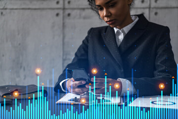 Businesswoman typing phone, work in modern office on new project. Financial graph hologram. Double exposure. Concept of success.