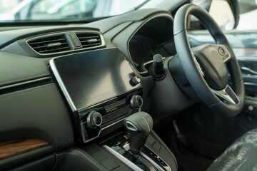 New car steering wheel,Interior view of car with black salon.