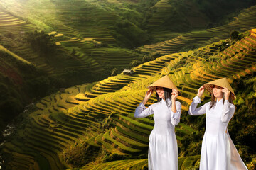 Beautiful woman in traditional Vietnam national costume Standing on the beautiful golden stairs of...