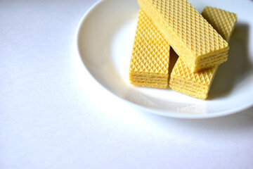 Some delicious sugar waffles on a white plate