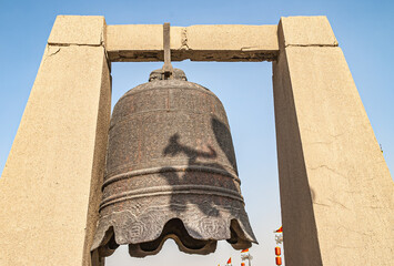 Xian, China - April 30, 2010: North Gate of Huancheng City Wall. Giant war bell on display above...