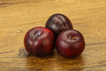 Ripe sweet plum fruit heap