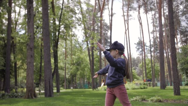 4K Slow Motion Shot Of A Cute Girl Throwing A Frisbee