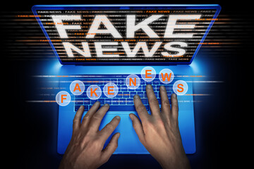 hacker spreading fake news on a lap top