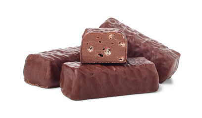 Three chocolate candies and candy bar in half isolated on white background