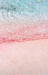 Fototapeta na wymiar Pink sand with the turquoise waters of the Mediterranean Sea, seen at Balos Beach, Crete, Greece.