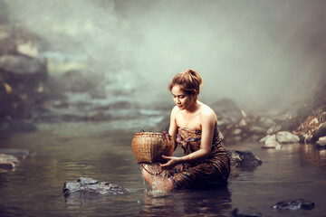 Asian sexy woman washing in streams The girl was bathing in the brook, woman washing in the stream, country girl portrait in outdoors.