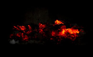 Fototapeta na wymiar Smoldering embers in the fireplace