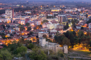 Obraz premium Pirot night cityscape at the beginning of autumn and foreground ancient fortress