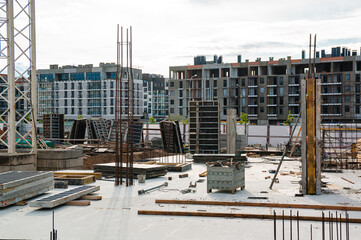 Large scale construction site featuring the foundation of what will be a large skyscraper.
