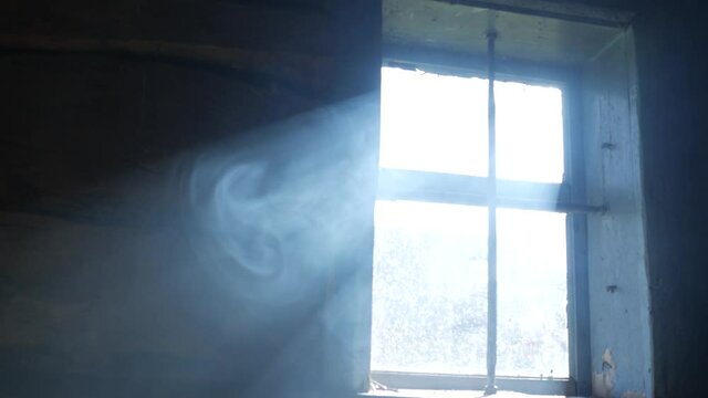 Smoke in a ray. Light falling from a window.