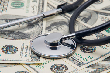 heap of dollars with stethoscope