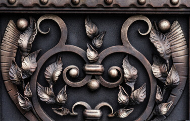 Decorative forged metal, exquisite gate elements. Decorations of the estate of the nobility