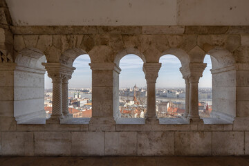 Hungary Parliament dome view through corridor column on fisherman's bastion on Budapest ountain