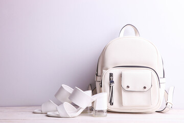 Stylish leather female backpack and sandals