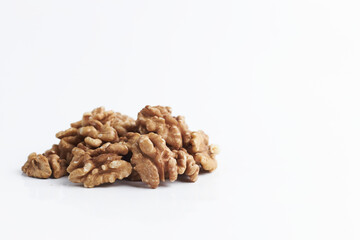 handful of walnuts on a white background. heap of raw nuts without a shell close-up isolate. copy space for text