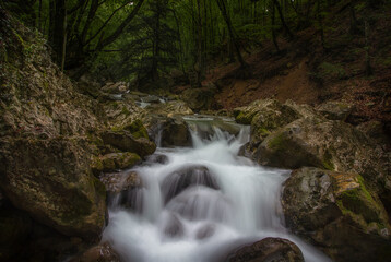 Fototapeta premium View of the rocky seashore at sunset