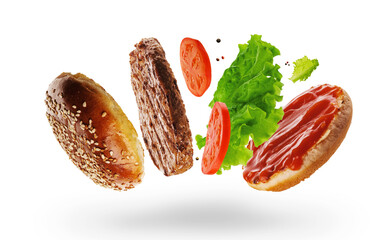 Classic burger with beef patty, tomato, lettuce and ketchup mustard isolated on white background. Levitation.