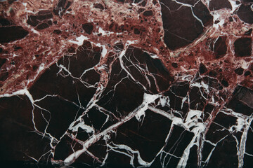 Burgundy marble with white streaks for background.