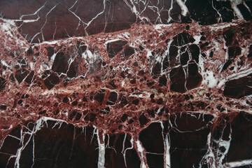 Burgundy marble with white streaks for background.