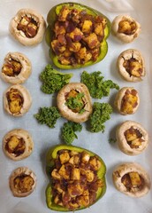 Baked mushroom and bell peppers stuffed with cottage cheese and kale 