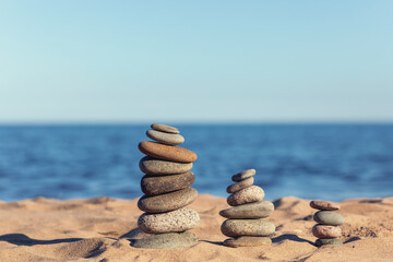Relaxing on the beach. stones for yoga.