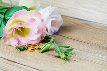 Wedding rings and Eustoma flower