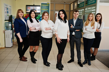 Portrait of young business people group of bank workers in modern office.