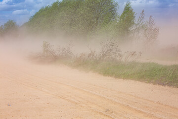 Dust storm over dry field