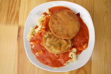 Original German Democratic Republic version of escalope chasseur with breaded Jagdwurst, noodles...