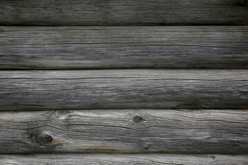 Background from the texture of the old gray wood logs
