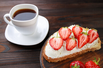 Strawberry bruschetta with cottage cheese. Homemade healthy toast. Fruit sweet sandwich with ripe summer berries
