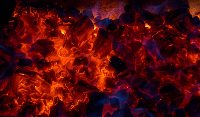 Burning coal, soft focus. Textures, background, abstract