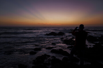 Fototapeta premium Photographer on the Pacific coast