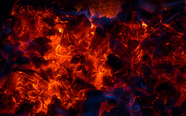Fototapeta na wymiar Burning coal, soft focus. Textures, background, abstract