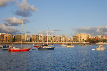 Fototapeta na wymiar Sailing yachts on the anchoring in the bay near Grand Canaria island waiting for ARC