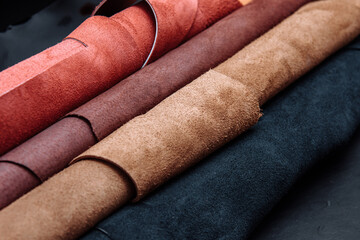 Multi-colored leather in rolls. Tanner work