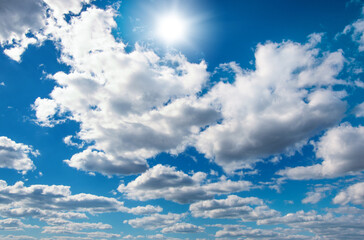 Fototapeta premium Blue sky with clouds and sun.