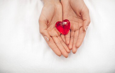 female hands holding red heart. Valentine day. Red heart. 