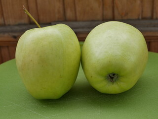 green apples on a wooden table