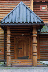 Old wooden door with a bolt and a lock