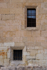 Ancient old windows on marble brick wall of Salamanca spain  