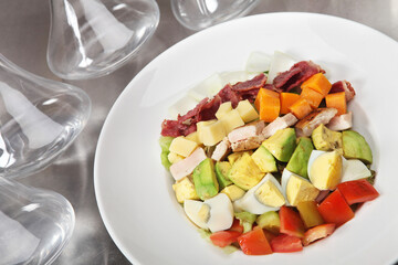 salad with vegetables and fruits and meat