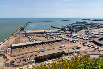 Fototapeta na wymiar DOVER, KENT, UK - MAY 2020: The Port of Dover with several ferries and lorries in sight on May 2020 in Dover, UK