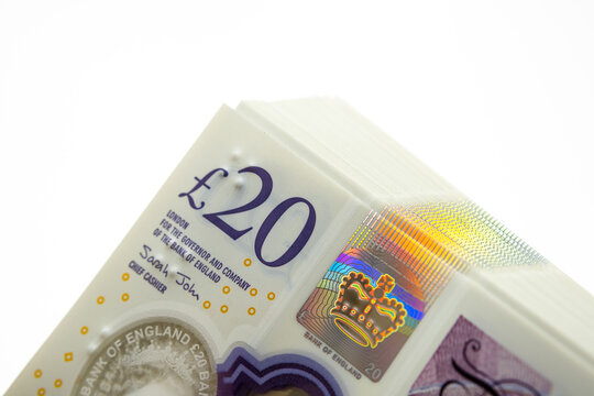 20 Sterling Pounds banknotes. Corner of the stack. New British polymer money. Macro photo.