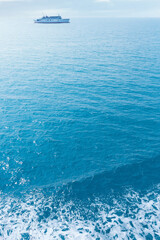Blue sunny sea water surface with Ferryboat.Summer time background.
