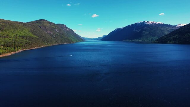 Aerial View of a Landscape nature of Norway, a fjord with a beautiful lake and mountains. stone coast.