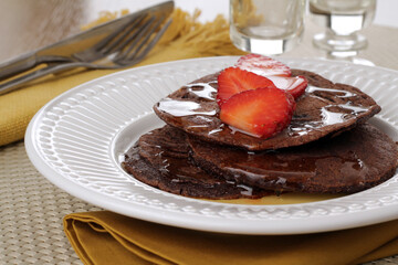 Chocolate waffle with honey and strawberry